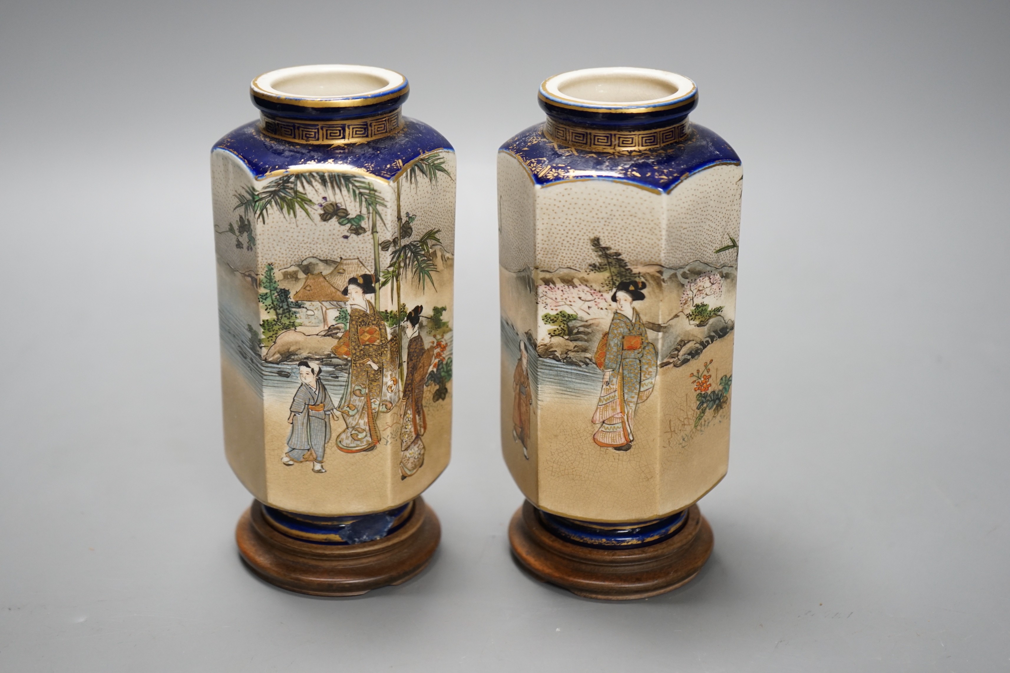 A pair of Japanese Satsuma pottery hexagonal vases, Meiji period, on stands 16cm